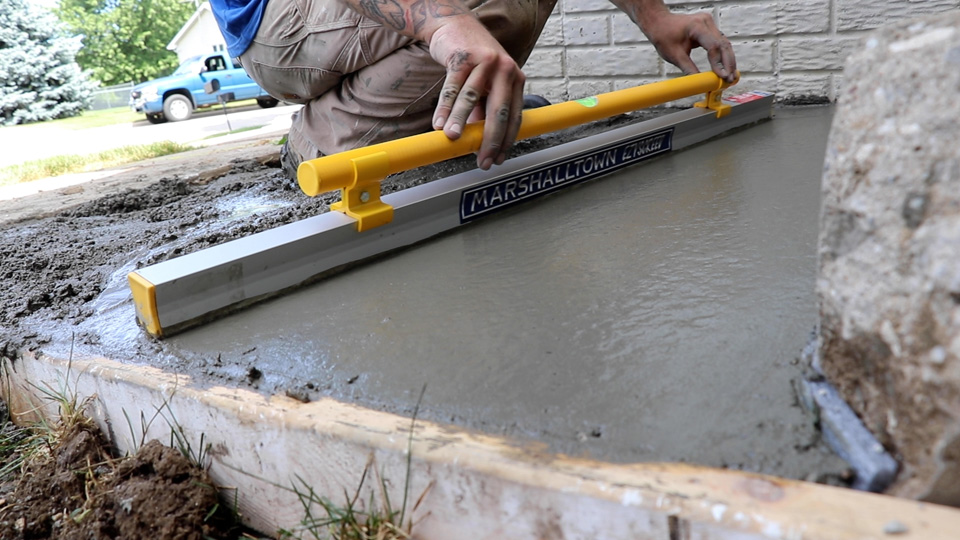 smoothing the surface with an ezyscreed